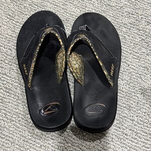 Reef Black and Gold Patterned Sandals